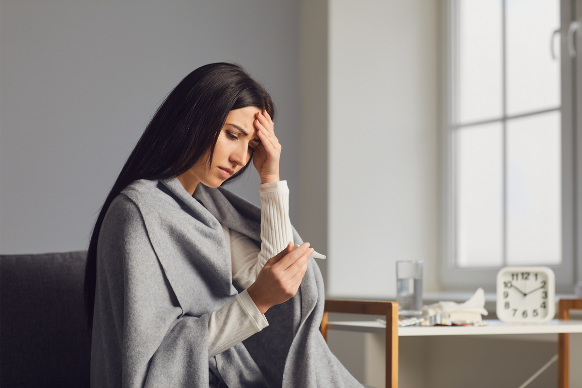 Can Allergies Cause Fever And How To Prevent Them SinuSonic   A Young Woman With A Fever Checking Her Temperature 1200x800 